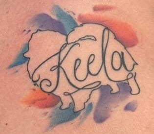 Pomeranian tattoo with the name Keela and watercolour splashes
